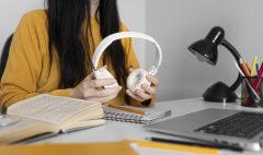 close-up-hands-holding-headphones