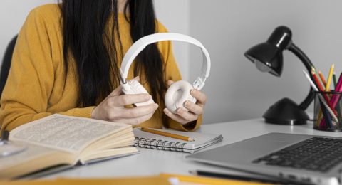 close-up-hands-holding-headphones