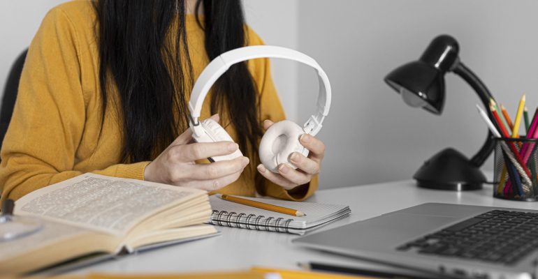 close-up-hands-holding-headphones